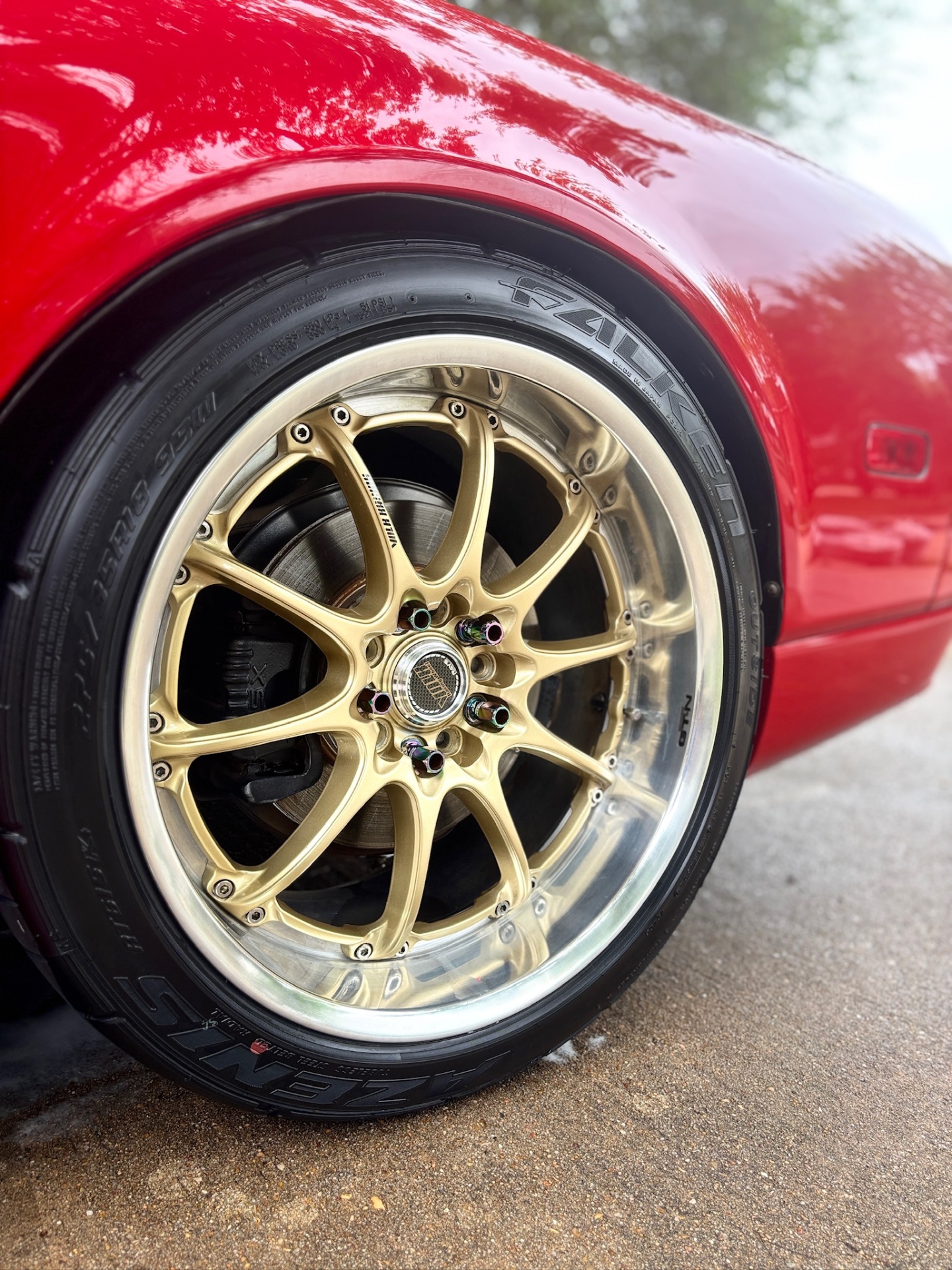 Gold wheel lip and tire after detailing